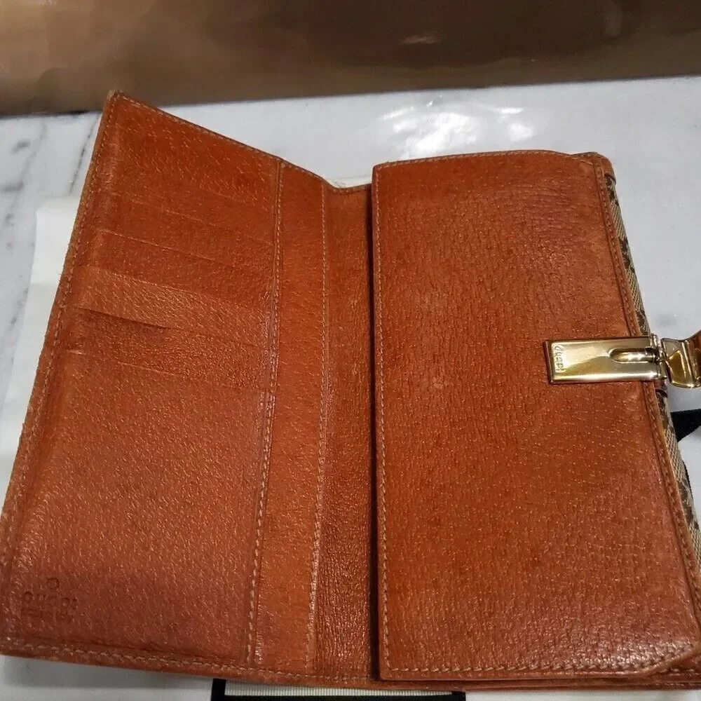 Gucci GG Logo Continental Canvas Tan Bifold Wallet with Leather Trim. 1462012778